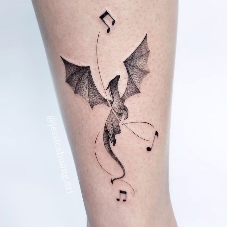 Fine Line dragon and music note tattoo design for women on leg tattoo ideas