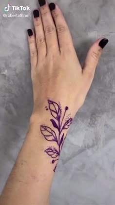 Fine line floral and flower tattoo design for women on forearm and hand tattoo ideas