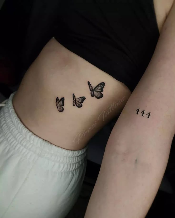 Fine line butterfly and numbers tattoo design for women on rib and forearm tattoo ideas