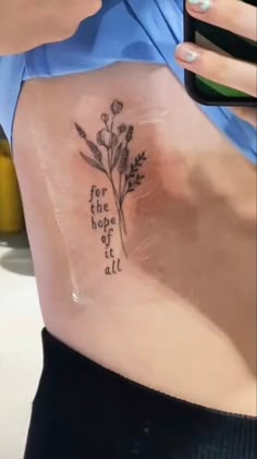 Fine line floral and quote tattoo design for women on rib tattoo ideas