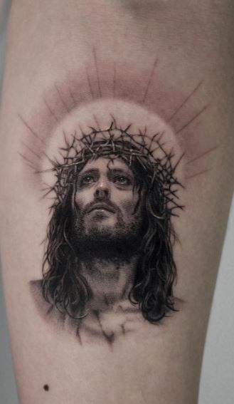Realistic Jesus with crown tattoo ideas for men and women on arm tattoo ideas