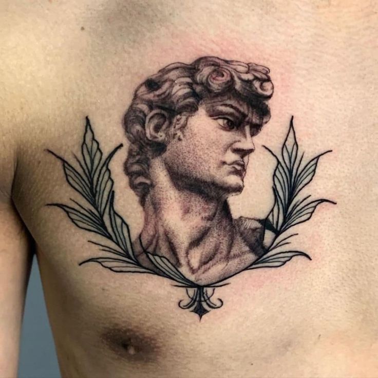 Realistic Greek statue and floral tattoo design for men on chest tattoo ideas
