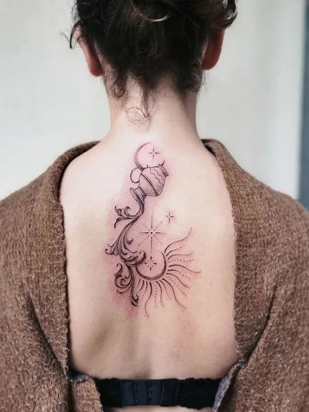 Fine line Aquarius, sun, and moon tattoo design for women on the back tattoo ideas