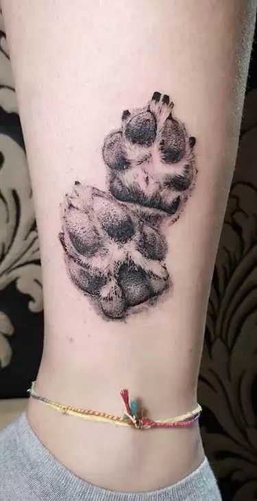Realistic paw print tattoo design for women on ankle tattoo ideas