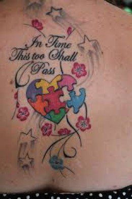 Script puzzle heart and flower tattoo design for women on back tattoo ideas