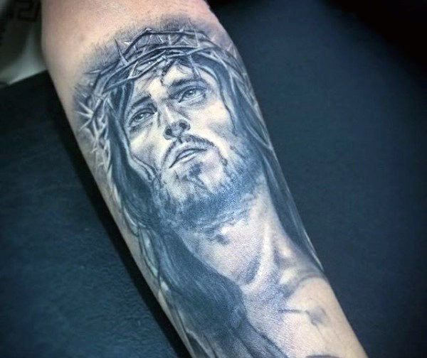 Realistic Jesus tattoo design for men on arm tattoo ideas