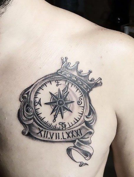 Realistic compass and crown tattoo design for men on chest tattoo ideas