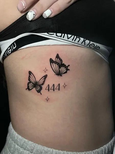 Fine line butterfly and 444 tattoo design for women on rib tattoo ideas