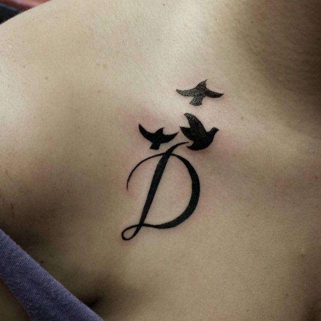 Script initial 'D' and bird tattoo design for women on chest tattoo ideas