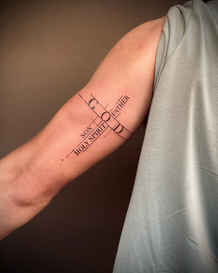 Religious cross and word tattoo design for men on forearm tattoo ideas
