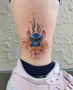 Cartoon Stitch with flowers tattoo design for women on ankle tattoo ideas