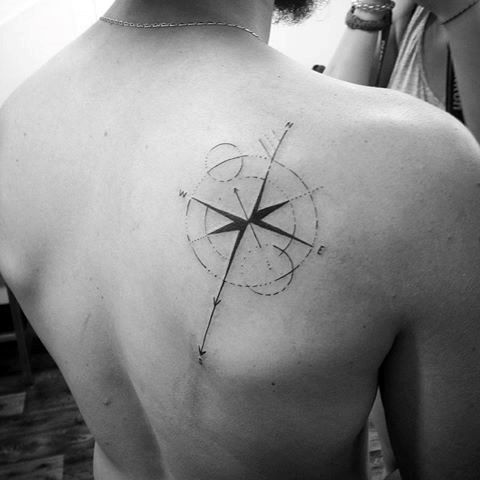 Geometric compass tattoo design for men on back tattoo ideas