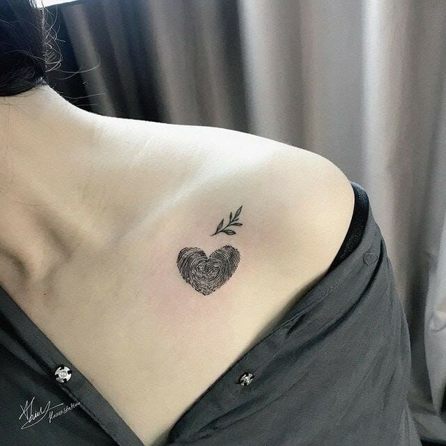 Fine line heart and fingerprint tattoo design for women on chest tattoo ideas