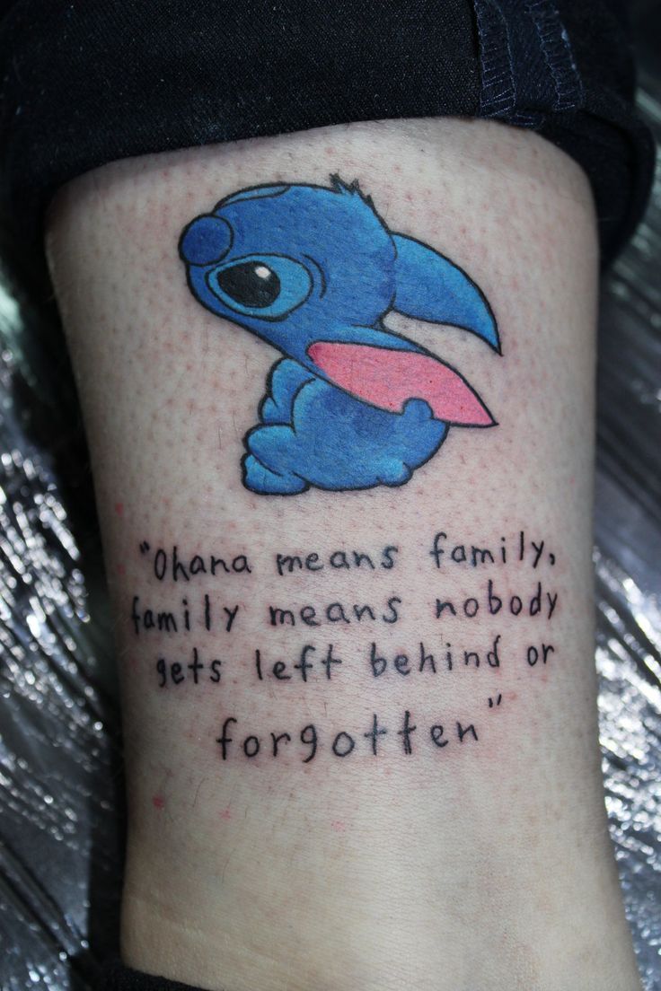 Anime Stitch and quote tattoo design for women on leg tattoo ideas