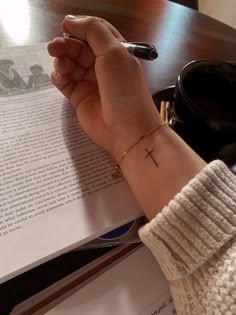 Minimalist cross tattoo design for women on wrist tattoo ideas