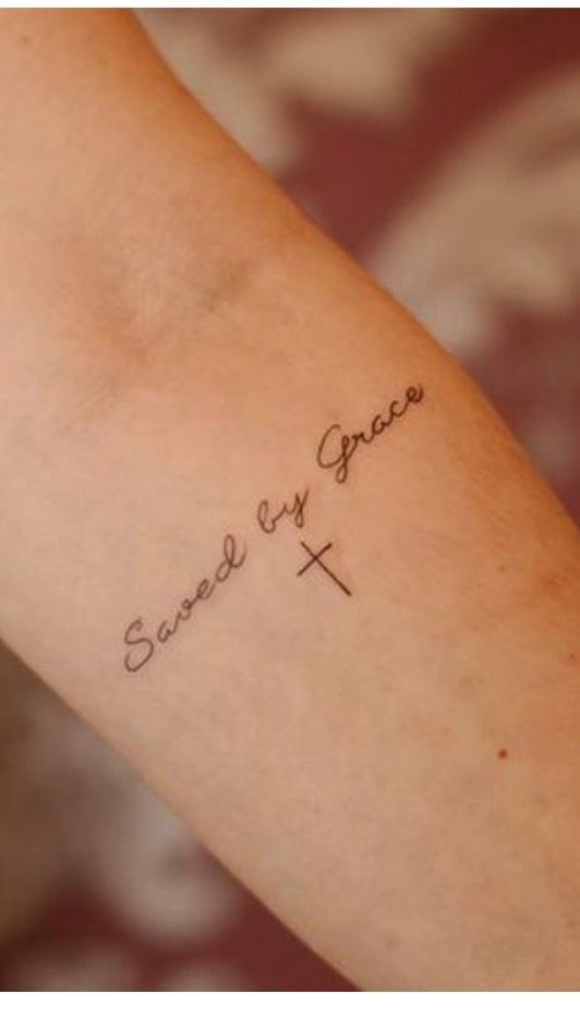 Fine line cross and quote tattoo design for women on arm tattoo ideas