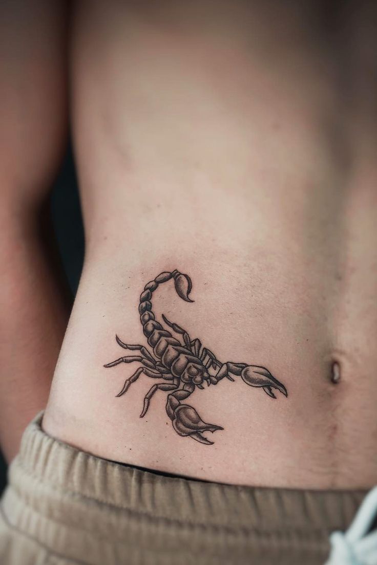 Black and grey scorpion tattoo design for men on rib tattoo ideas