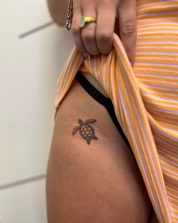 Minimalist turtle tattoo design for women on thigh tattoo ideas
