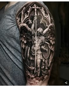 Realistic Saint Michael, sword, and wing tattoo design for men on upper arm and shoulder tattoo ideas