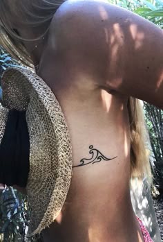 Minimalist wave fine line tattoo design for women on rib tattoo ideas