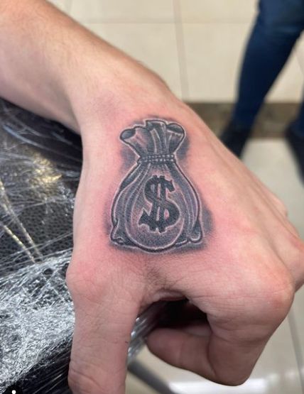 Money bag tattoo design for men on hand tattoo ideas