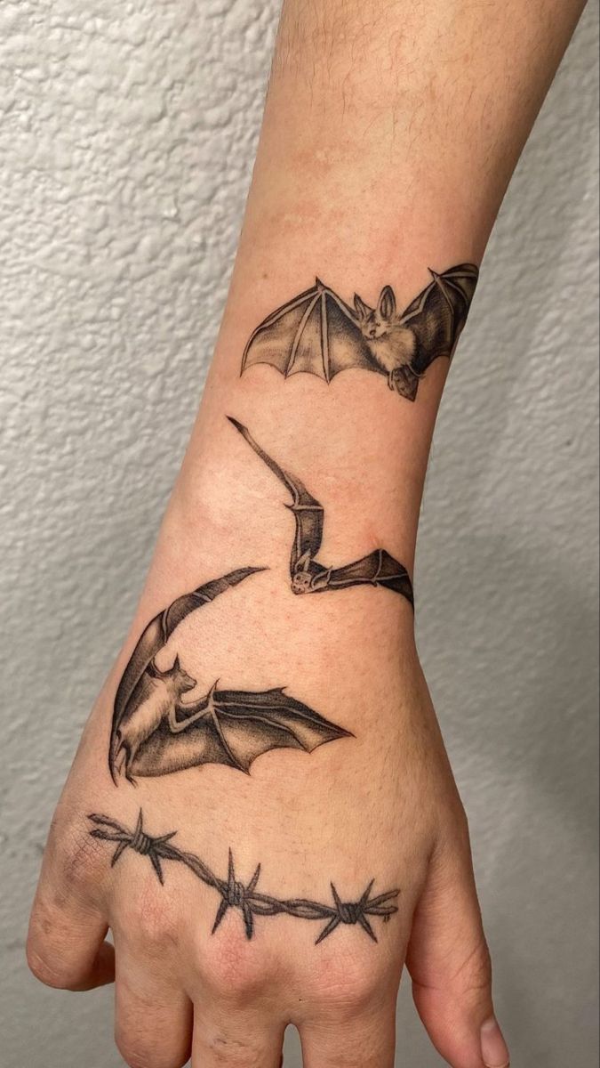Black and Grey realistic bat and barb wire tattoo design for men on forearm and hand tattoo ideas