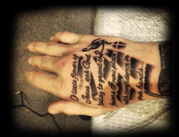 Script tattoo design with flower and eye symbols for men on hand tattoo ideas