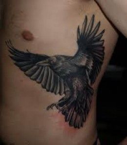 Realistic raven tattoo design for men on rib tattoo ideas