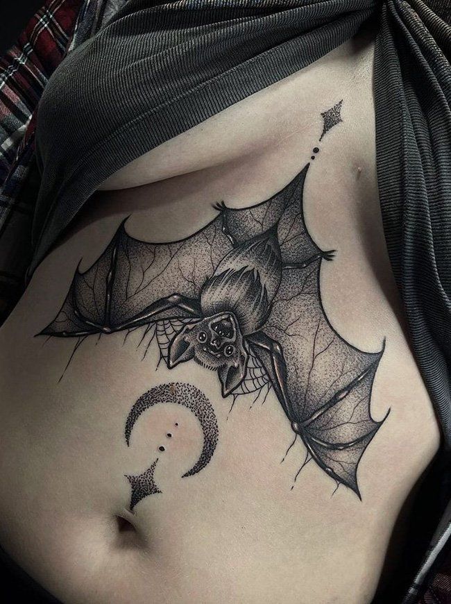 Blackwork bat and moon tattoo design for women on chest tattoo ideas