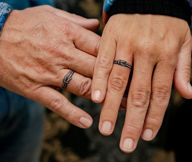 Fine line knot tattoo design for couples on finger and wrist tattoo ideas