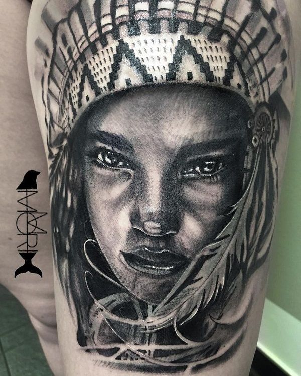Realistic Native American feather tattoo design for women on thigh tattoo ideas