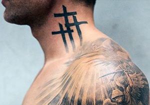 Blackwork cross tattoo design for men on neck and shoulder tattoo ideas