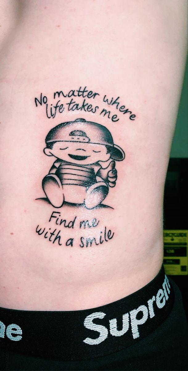 Sketch style quote with a smiling boy tattoo design, for men and women tattoo ideas