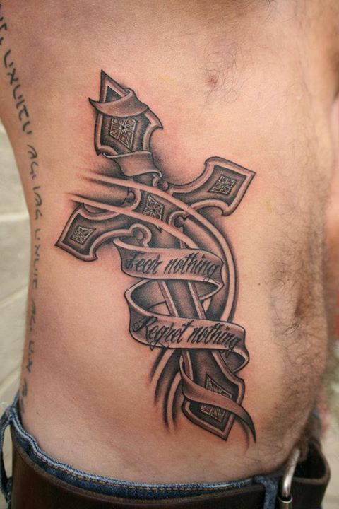 Black and grey cross with words tattoo design for men on rib tattoo ideas