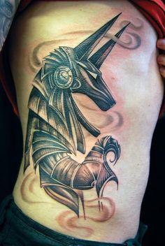 Anubis biomechanical tattoo design for men on rib tattoo ideas