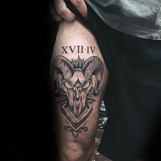 Black and grey ram skull with crown and Roman numeral tattoo design for men on thigh tattoo ideas