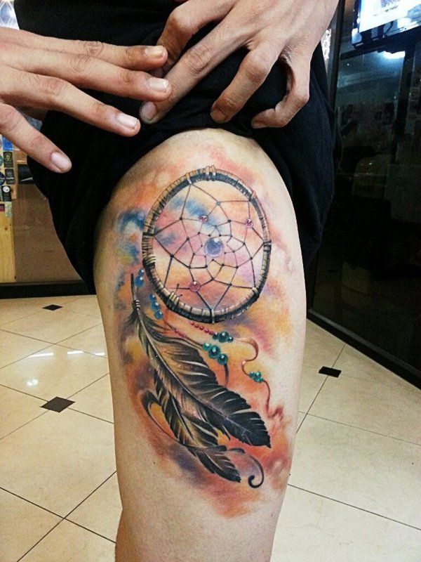 Watercolor dreamcatcher and feather tattoo design for women on thigh tattoo ideas