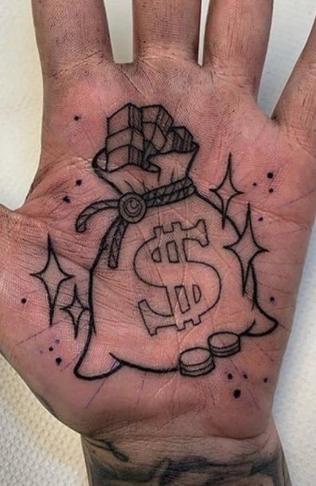 Money bag and dollar sign tattoo design for men on hand tattoo ideas