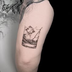 Black and Grey bourbon glass with mountain and water tattoo design for men on thigh tattoo ideas