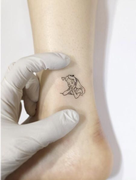 Fine line Alice in Wonderland tattoo design for women on ankle tattoo ideas
