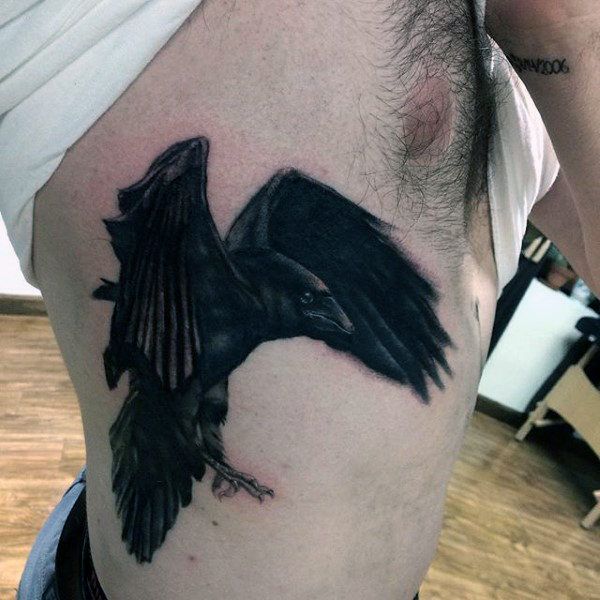 Realistic raven tattoo design for men on rib tattoo ideas