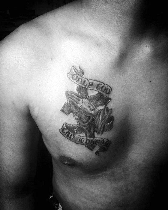 Black and grey praying hands cross tattoo design for men on chest with faith quotes tattoo ideas