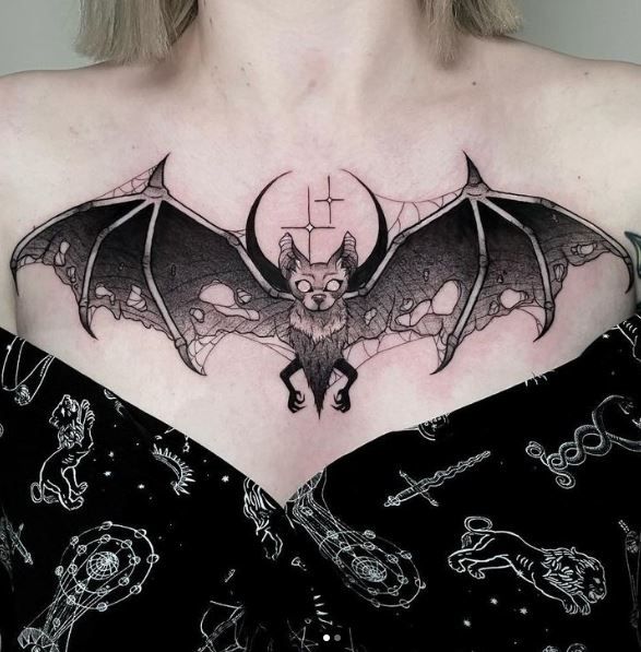 Blackwork bat, moon, and spider tattoo design for women on chest tattoo ideas