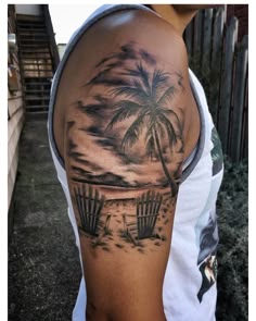 Realistic beach scene tattoo design for men on upper arm tattoo ideas