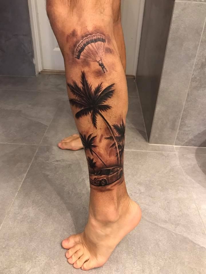 Realistic palm tree and motorbike tattoo design for men on leg and calf tattoo ideas