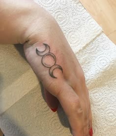 Blackwork triple moon tattoo design for women on hand tattoo ideas