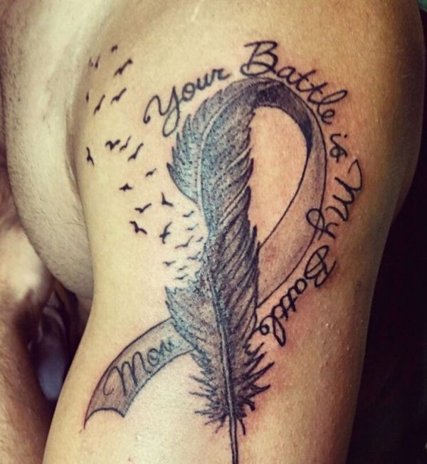 Black and grey feather and quote tattoo design for men on shoulder and arm tattoo ideas