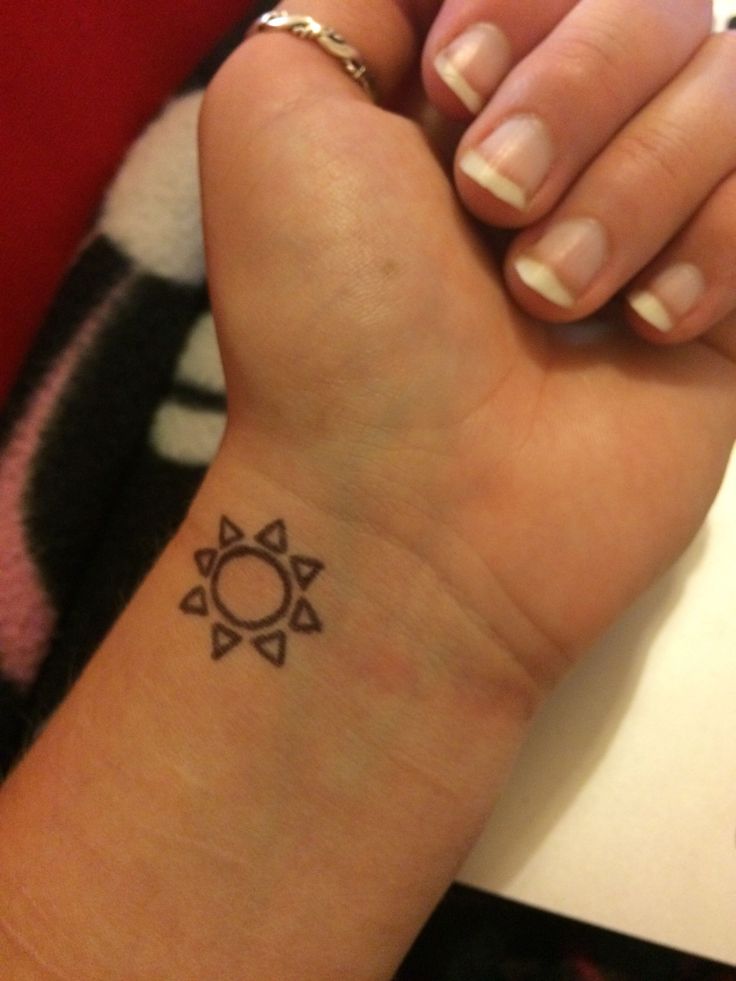 Minimalist sun tattoo design for women on wrist tattoo ideas