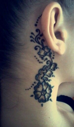 Floral blackwork tattoo design for women behind the ear tattoo ideas