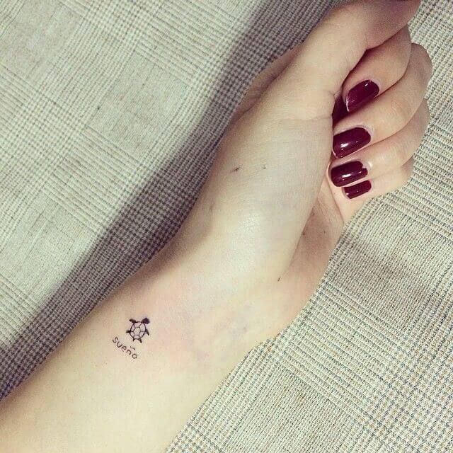 Fine line turtle and quote tattoo design for women on wrist tattoo ideas